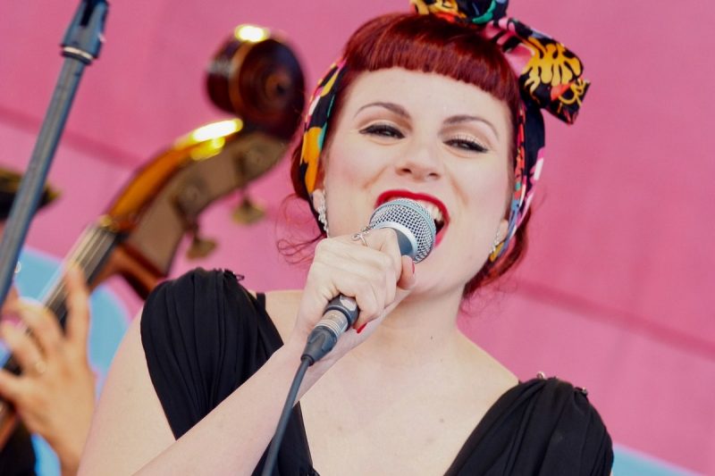 Singer Performing with Band Bright Colors
